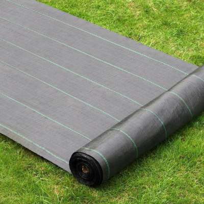 Plastic ground cover cloth weed block fabric matting in garden farm nursery greenhouse